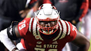 Oct 30, 2021; Raleigh, North Carolina, USA; North Carolina State Wolfpack tackle Ikem Ekwonu (79) warms up prior to a game against the Louisville Cardinals at Carter-Finley Stadium. Mandatory Credit: Rob Kinnan-Imagn Images
