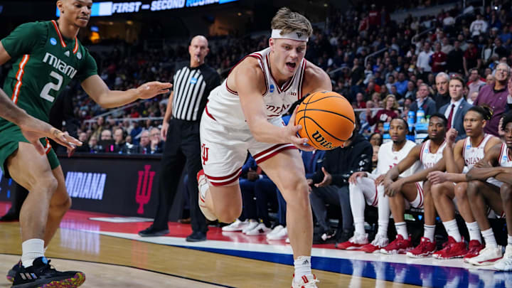 Indiana Hoosiers forward Miller Kopp (12) reaches for the ball against the Miami (Fl) Hurricanes during the second half at MVP Arena. Indiana Hoosiers forward Miller Kopp (12) reaches for the ball against the Miami (Fl) Hurricanes during the second half at MVP Arena.