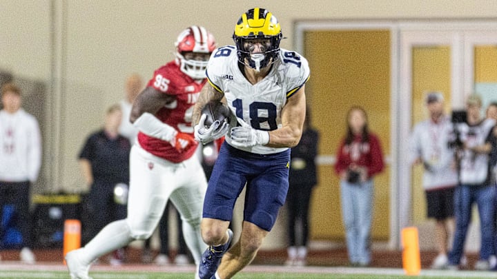 Nov 9, 2024; Bloomington, Indiana, USA; Michigan Wolverines tight end Colston Loveland (18) runs with the ball in the second half against the Indiana Hoosiers at Memorial Stadium. Mandatory Credit: Trevor Ruszkowski-Imagn Images