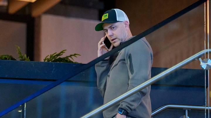 Oregon offensive coordinator Will Stein speaks on the phone as Indiana speaks during a media day as the Oregon Ducks arrive on Jan. 7, 2025, in Atlanta, Georgia ahead of the Peach Bowl at Mercedes-Benz Stadium.