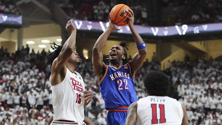 Feb 2, 2026; Lubbock, Texas, USA;  Kansas Jayhawks guard Darryn Peterson (22) goes to the basket against Texas Tech Red Raiders forward JT Toppin (15) in the first half at United Supermarkets Arena. Mandatory Credit: Michael C. Johnson-Imagn Images