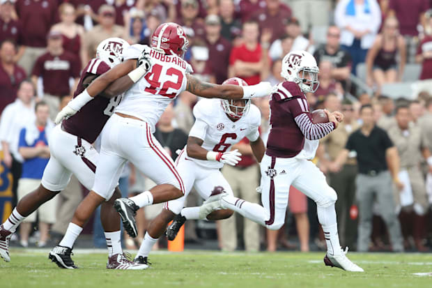 Texas A&M Aggies  quarterback Johnny Manziel (2) scrambles against the Alabama Crimson Tide at Kyle Field.