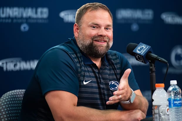 Penn State offensive coordinator Andy Kotelnicki talks with reporters during football media day.