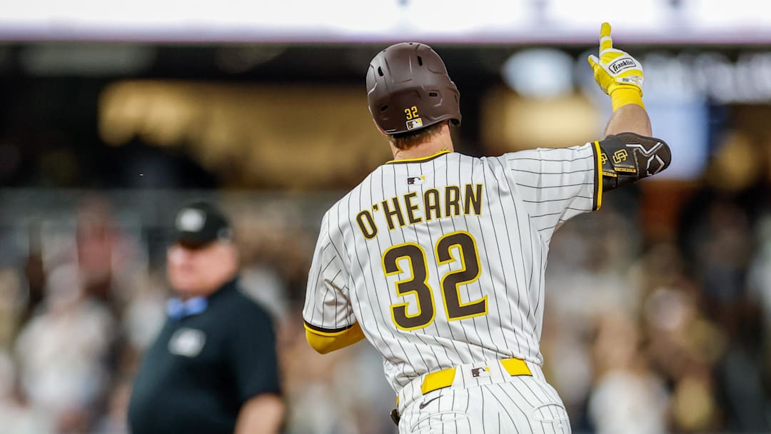 Sep 23, 2025; San Diego, California, USA; San Diego Padres first baseman Ryan O'Hearn (32) celebrates after hitting a grand slam during the first inning against the Milwaukee Brewers at Petco Park. Mandatory Credit: David Frerker-Imagn Images