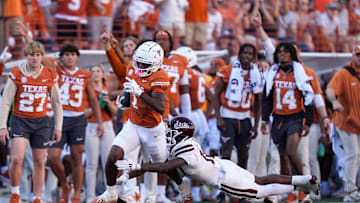 Sep 28, 2024; Austin, Texas, USA;  Mississippi State Bulldogs safety Corey Ellington (10) tackles Texas Longhorns wide receiver Johntay Cook II (1) in the second half at Darrell K Royal-Texas Memorial Stadium. Mandatory Credit: Daniel Dunn-Imagn Images