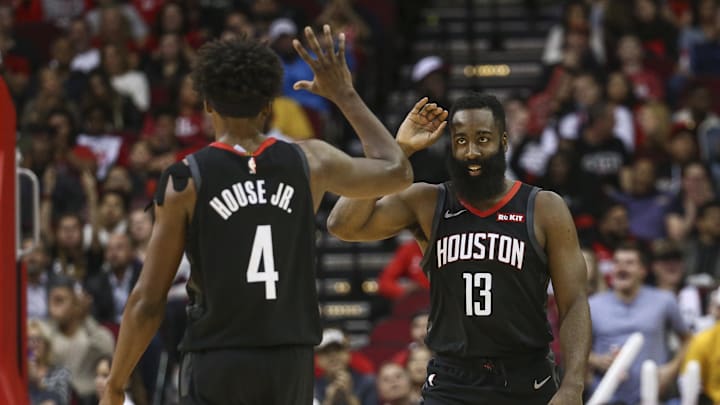 Nov 27, 2019; Houston, TX, USA; Houston Rockets guard James Harden (13) celebrates with forward Danuel House Jr. (4) after a play against the Miami Heat during the second quarter at Toyota Center. Mandatory Credit: Troy Taormina-Imagn Images