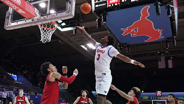 SMU Mustangs guard Chuck Harris (3) drives to the basket against the Louisville Cardinals during the second half.