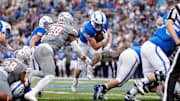 Air Force Falcons running back Dylan Carson (20) runs the ball as UNLV Rebels linebacker Marsel McDuffie (38) defends in the first quarter at Falcon Stadium. 