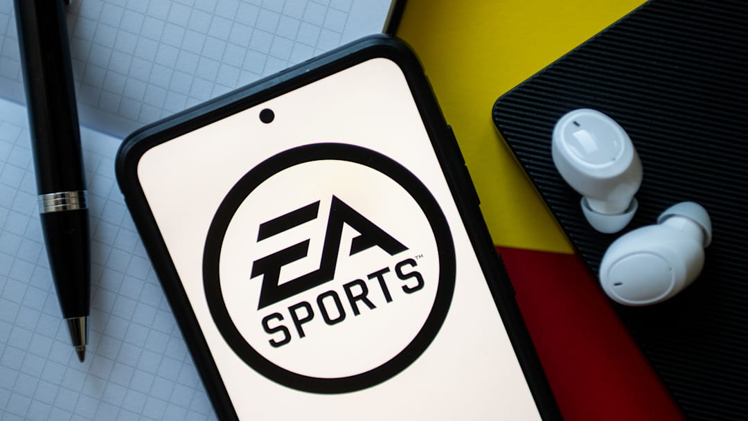 In this photo illustration an EA Sports logo seen displayed...