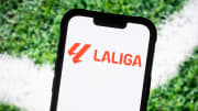In this photo illustration, a Laliga  logo seen displayed on
