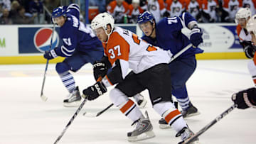 Sep 17, 2009; London, ON, Canada; Philadelphia Flyers center Jonathon Kalinski (37) skates with the puck against the Toronto Maple Leafs at the John Labatt Centre. Mandatory Credit: Tom Szczerbowski-Imagn Images