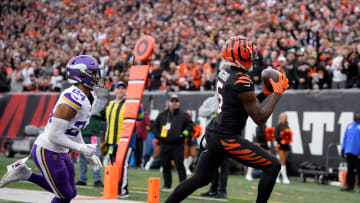 Cincinnati Bengals wide receiver Tee Higgins (5) makes a 13-yard touchdown in the 4th quarter over Minnesota Vikings at Paycor Stadium Saturday, December 16, 2023.