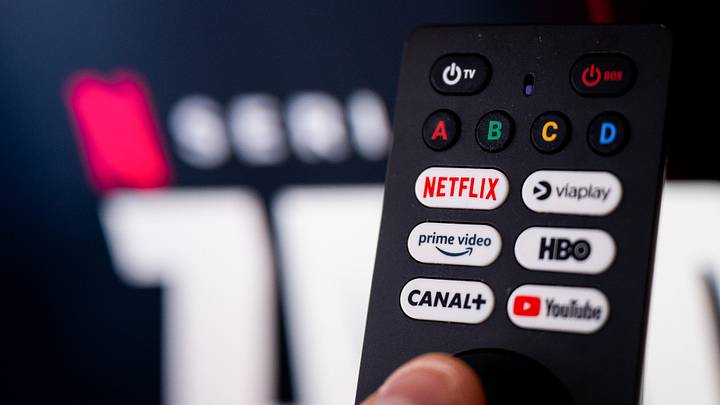 In this photo illustration a Netflix logo seen on a TV...