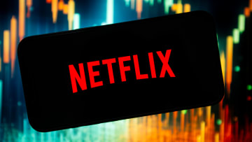 In this photo illustration, a Netflix logo seen displayed on...
