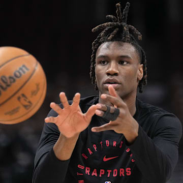 Mar 23, 2025; Toronto, Ontario, CAN; Toronto Raptors guard Ja'Kobe Walter (14) takes a pass during warmups before a game against the San Antonio Spurs at Scotiabank Arena. Mandatory Credit: John E. Sokolowski-Imagn Images
