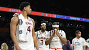 Auburn Tigers players walk off the court after losing to the Florida Gators in the semifinals of the men's Final Four of the 2025 NCAA Tournament at the Alamodome.