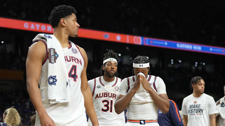 Auburn Tigers players walk off the court after losing to the Florida Gators in the semifinals of the men's Final Four of the 2025 NCAA Tournament at the Alamodome.