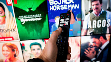 In this photo illustration a Netflix logo seen on a TV...
