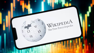 In this photo illustration a Wikipedia logo seen displayed...
