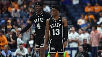 Mar 15, 2024; Nashville, TN, USA; Mississippi State Bulldogs forward Cameron Matthews (4) and guard Josh Hubbard (13) celebrate late in the second half of a win against the Tennessee Volunteers at Bridgestone Arena. Mandatory Credit: Christopher Hanewinckel-Imagn Images