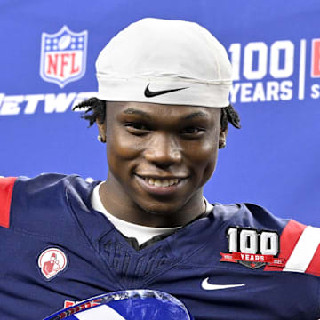 Jan 30, 2025; Arlington, TX, USA; East running back Jacory Croskey-Merritt of Arizona (31) is presented with the offensive MVP trophy after the East defeats the West in the East-West Shrine Bowl at AT&T Stadium. Mandatory Credit: Jerome Miron-Imagn Images
