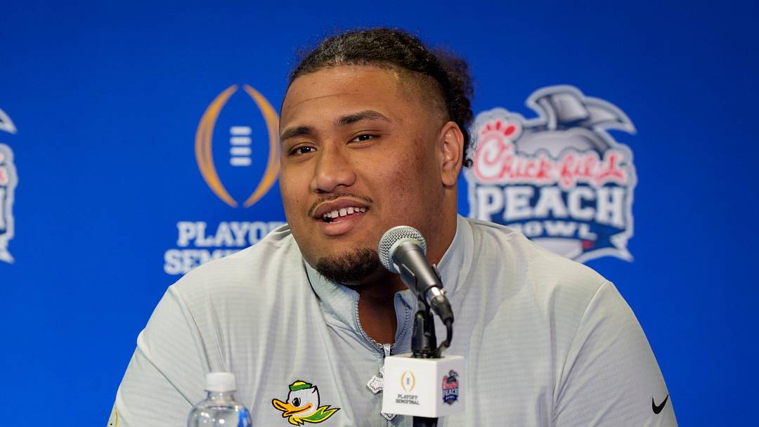 Oregon center Iapani Laloulu speaks during a media day as the Oregon Ducks arrive on Jan. 7, 2025, in Atlanta, Georgia ahead of the Peach Bowl at Mercedes-Benz Stadium. Oregon center Iapani Laloulu speaks during a media day as the Oregon Ducks arrive on Jan. 7, 2025, in Atlanta, Georgia ahead of the Peach Bowl at Mercedes-Benz Stadium.