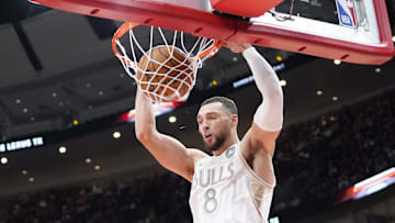 Jan 25, 2025; Chicago, Illinois, USA; Chicago Bulls guard Zach LaVine (8) dunks the ball against the Philadelphia 76ers during the first quarter at United Center. Mandatory Credit: David Banks-Imagn Images