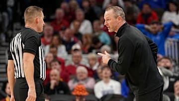 Drake Bulldogs head coach Darian DeVries talks to an official in a first-round NCAA Tournament game