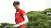 Nelly Korda (USA) reacts after teeing off during the final round of the women's individual stroke play of the Tokyo 2020 Olympics at Kasumigaseki Country Club. 