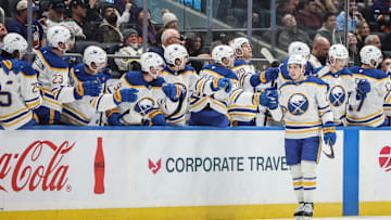 Buffalo Sabres right wing Jack Quinn celebrates with his teammates after scoring a goal in the second period against the New York Islanders.