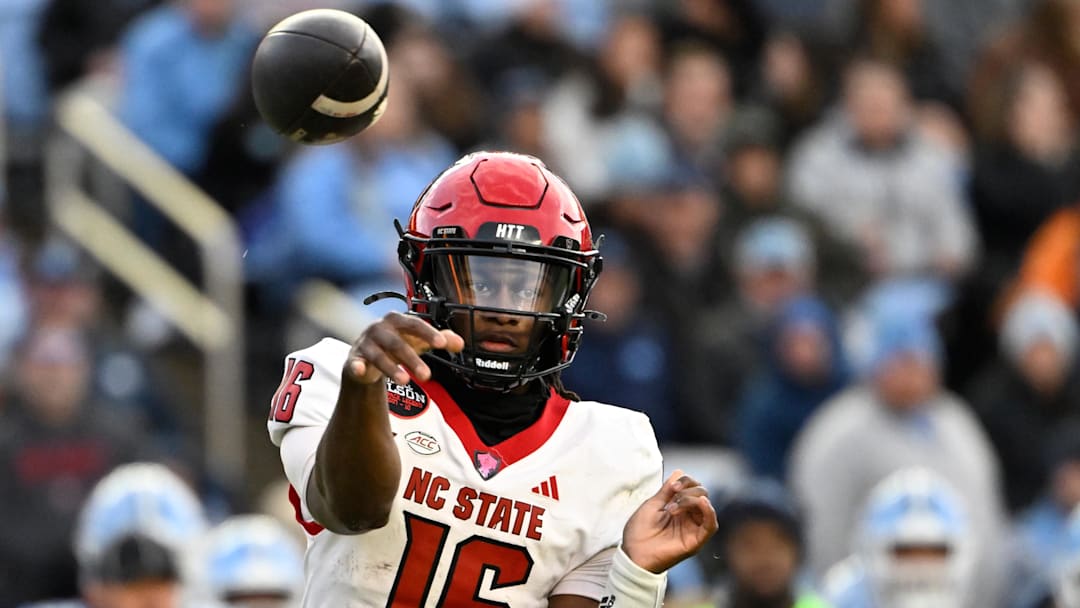 Nov 30, 2024; Chapel Hill, North Carolina, USA; North Carolina State Wolfpack quarterback CJ Bailey (16) passes the ball in the first quarter at Kenan Memorial Stadium. Mandatory Credit: Bob Donnan-Imagn Images