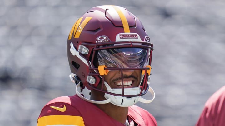 Aug 10, 2024; East Rutherford, New Jersey, USA; Washington Commanders quarterback Jayden Daniels (5) warms up before the game against the New York Jets at MetLife Stadium. Mandatory Credit: Lucas Boland-USA TODAY Sports