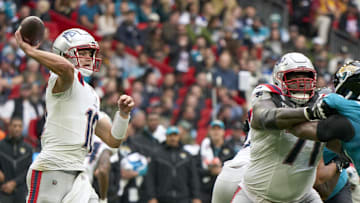 Oct 20, 2024; London, United Kingdom; New England Patriots quarterback Drake Maye (10) throws the ball  in the first half during an NFL International Series game at Wembley Stadium. Mandatory Credit: Peter van den Berg-Imagn Images