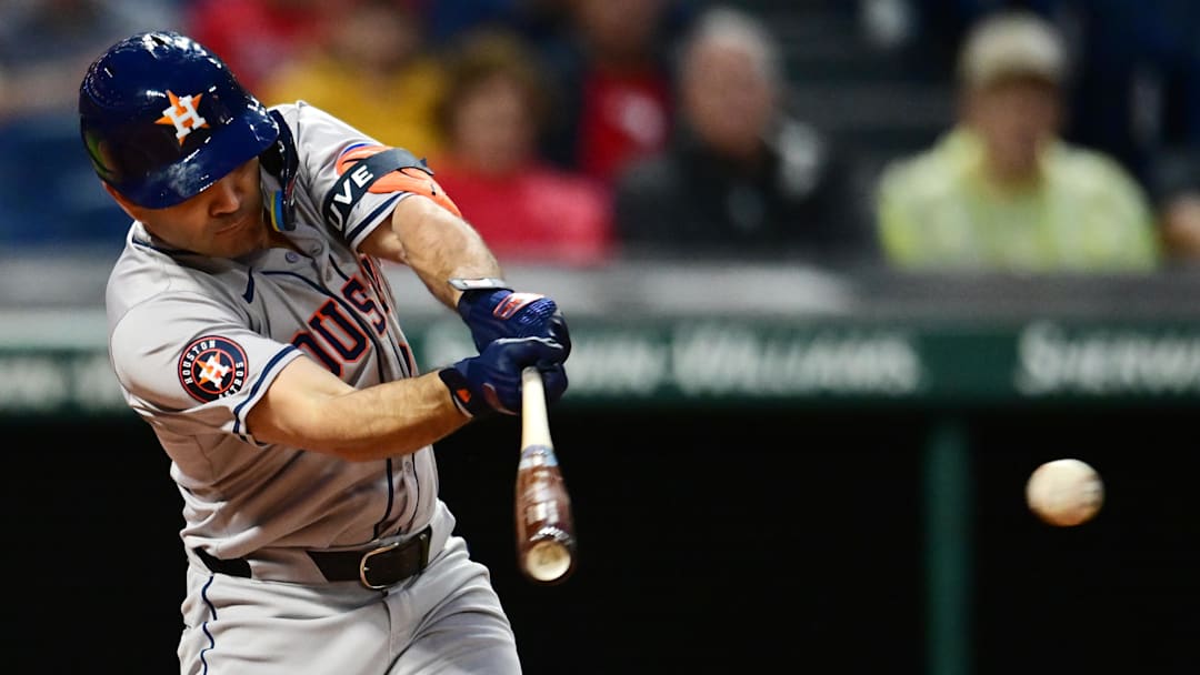 Sep 27, 2024; Cleveland, Ohio, USA; Houston Astros second baseman Jose Altuve (27) hits a double during the first inning against the Cleveland Guardians at Progressive Field.