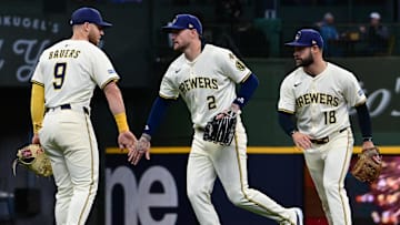Apr 16, 2025; Milwaukee, Wisconsin, USA;  Milwaukee Brewers first baseman Jake Bauers (9), second baseman Brice Turang (2)  and third baseman Vinny Capra (18) celebrate after defeating the Detroit Tigers at American Family Field. Mandatory Credit: Benny Sieu-Imagn Images