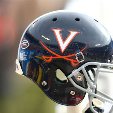 Dec 29, 2018; Charlotte, NC, USA; A Virginia Cavaliers helmet sits on the bench in the second quarter against the South Carolina Gamecocks in the 2018 Belk Bowl at Bank of America Stadium. Mandatory Credit: Jeremy Brevard-Imagn Images