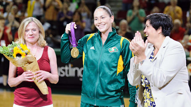 Seattle Storm owners Dawn Trudeau and Lisa Brummel with guard Sue Bird