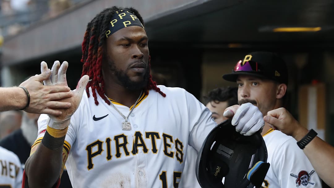Jul 22, 2025; Pittsburgh, Pennsylvania, USA;  Pittsburgh Pirates center fielder Oneil Cruz (15) high-fives in the dugout after scoring a run on a Detroit Tigers error during the third inning at PNC Park. Mandatory Credit: Charles LeClaire-Imagn Images