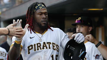 Jul 22, 2025; Pittsburgh, Pennsylvania, USA;  Pittsburgh Pirates center fielder Oneil Cruz (15) high-fives in the dugout after scoring a run on a Detroit Tigers error during the third inning at PNC Park. Mandatory Credit: Charles LeClaire-Imagn Images