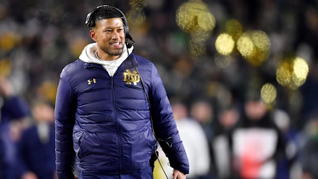 Marcus Freeman coaches Notre Dame during a CFP game against Indiana
