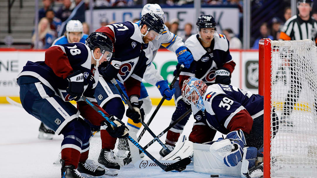Apr 5, 2026; Denver, Colorado, USA; Colorado Avalanche goaltender MacKenzie Blackwood (39) covers the puck as center Jack Drury (18) and defenseman Brett Kulak (27) and defenseman Sam Malinski (70) defend in the third period against the St. Louis Blues at Ball Arena. Mandatory Credit: Isaiah J. Downing-Imagn Images