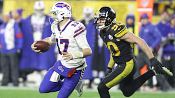Dec 15, 2019; Pittsburgh, PA, USA; Buffalo Bills quarterback Josh Allen (17) scrambles away from Pittsburgh Steelers outside linebacker T.J. Watt (90) during the fourth quarter at Heinz Field. 