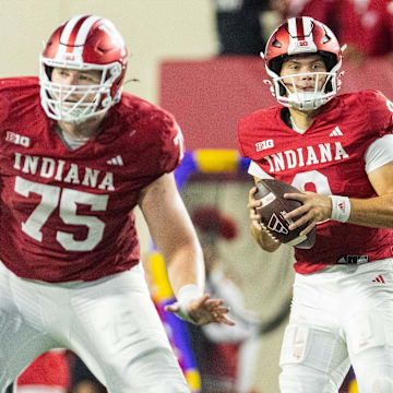 Indiana Hoosiers quarterback Kurtis Rourke (9) looks to pass the ball  as offensive linemen Trey Wedig (75) and Bray Lynch (74) block against Western Illinois at Memorial Stadium.