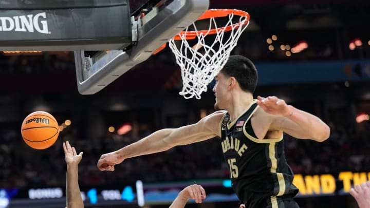 Purdue Boilermakers center Zach Edey (15) blocks Connecticut Huskies guard Tristen Newton's (2) shot 