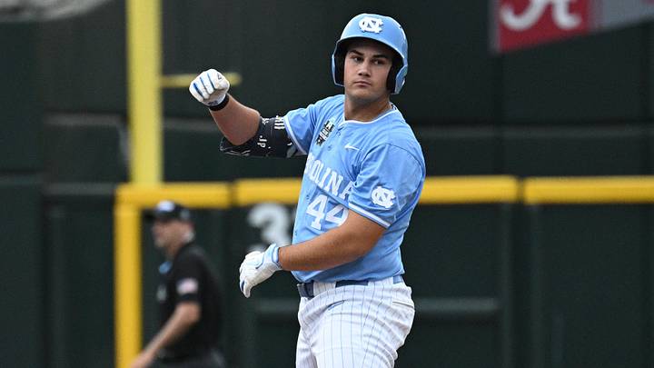 Jun 20, 2026; Omaha, NE, USA; North Carolina Tar Heels first baseman Erik Paulsen (44) signals after hitting a double against the Oklahoma Sooners during the first inning at Charles Schwab Field. Mandatory Credit: Steven Branscombe-Imagn Images