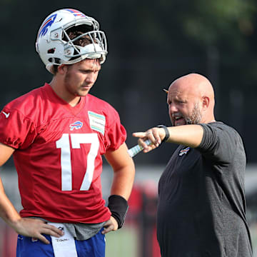 Bills offensive coordinator Brian Daboll goes over some things quarterback Josh Allen during training camp.