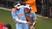 Tennessee utility Ella Dodge and Tennessee outfielder Kinsey Fiedler smile after winning a NCAA super regionals softball game against the Nebraska Cornhuskers and advancing to the Women's College World Series.
