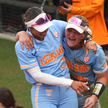 Tennessee utility Ella Dodge and Tennessee outfielder Kinsey Fiedler smile after winning a NCAA super regionals softball game against the Nebraska Cornhuskers and advancing to the Women's College World Series.