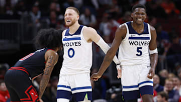 Nov 7, 2024; Chicago, Illinois, USA; Minnesota Timberwolves guard Anthony Edwards (5) and guard Donte DiVincenzo (0) react during the second half of a basketball game against the Chicago Bulls at United Center. Mandatory Credit: Kamil Krzaczynski-Imagn Images