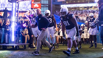 Penn State football head coach James Franklin leads the team onto the field prior to the game against the Boise State Broncos in the Fiesta Bowl at State Farm Stadium